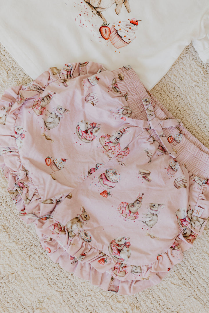 Confetti Kidz Ruffle Shorties in Sugar Bunnies, close view of the print and ruffle trim