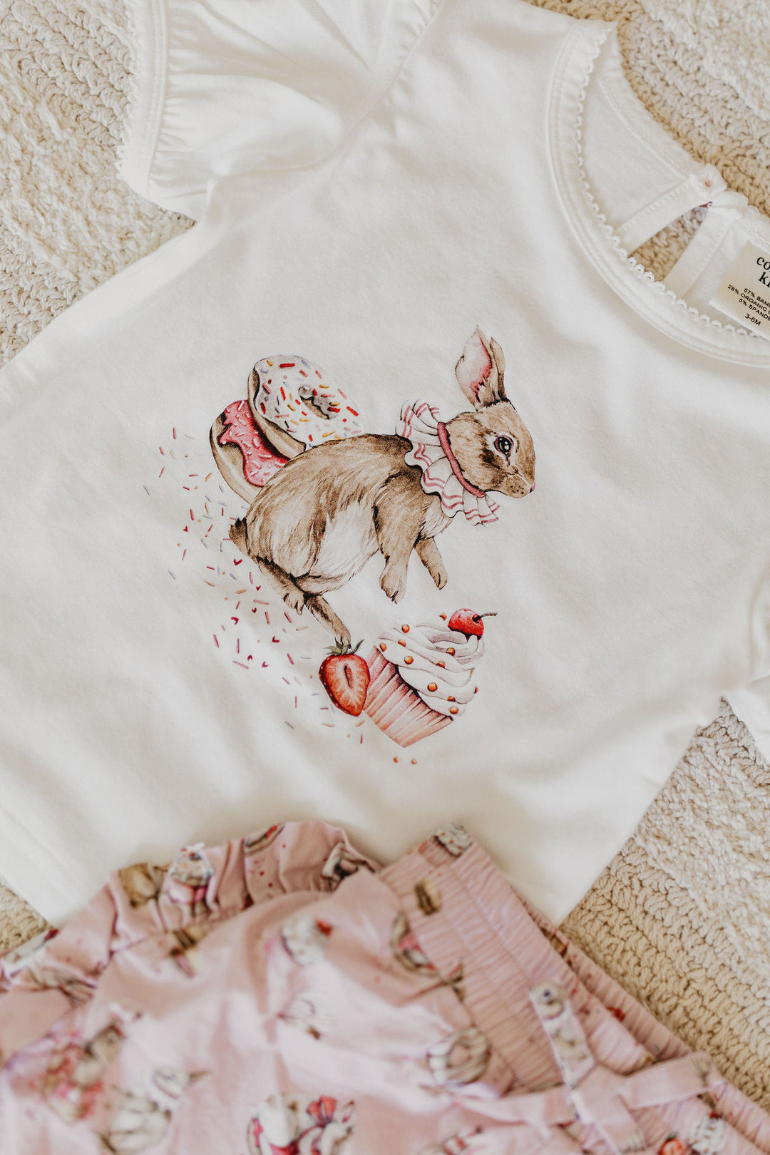 Confetti Kidz Ruffle Shorties in Sugar Bunnies, laid flat with the matching tee (tee not included)