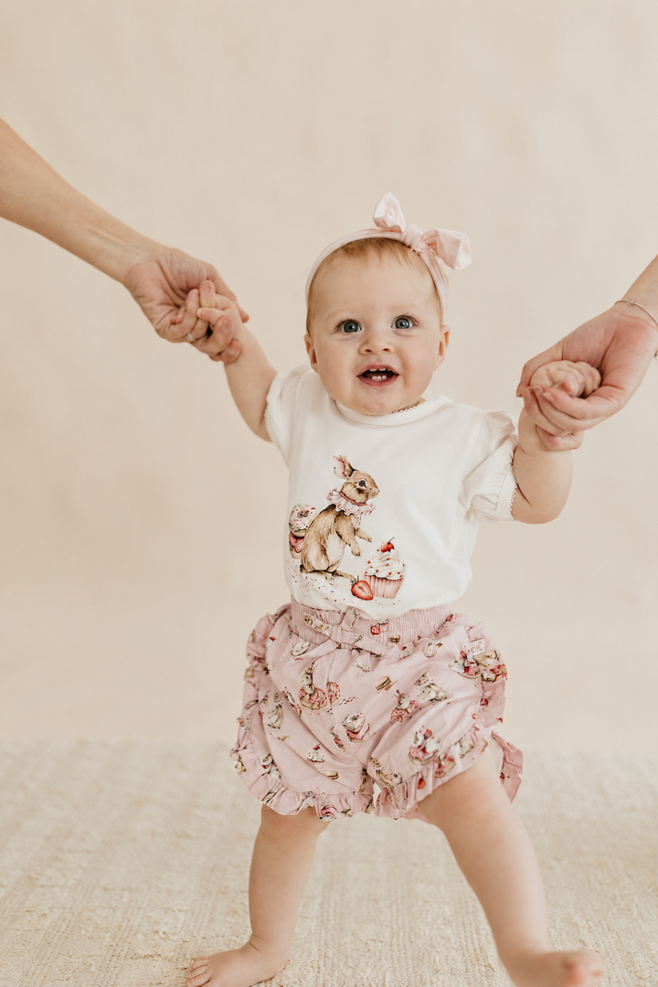 Confetti Kidz Ruffle Shorties in Sugar Bunnies, worn with the matching tee (tee not included)