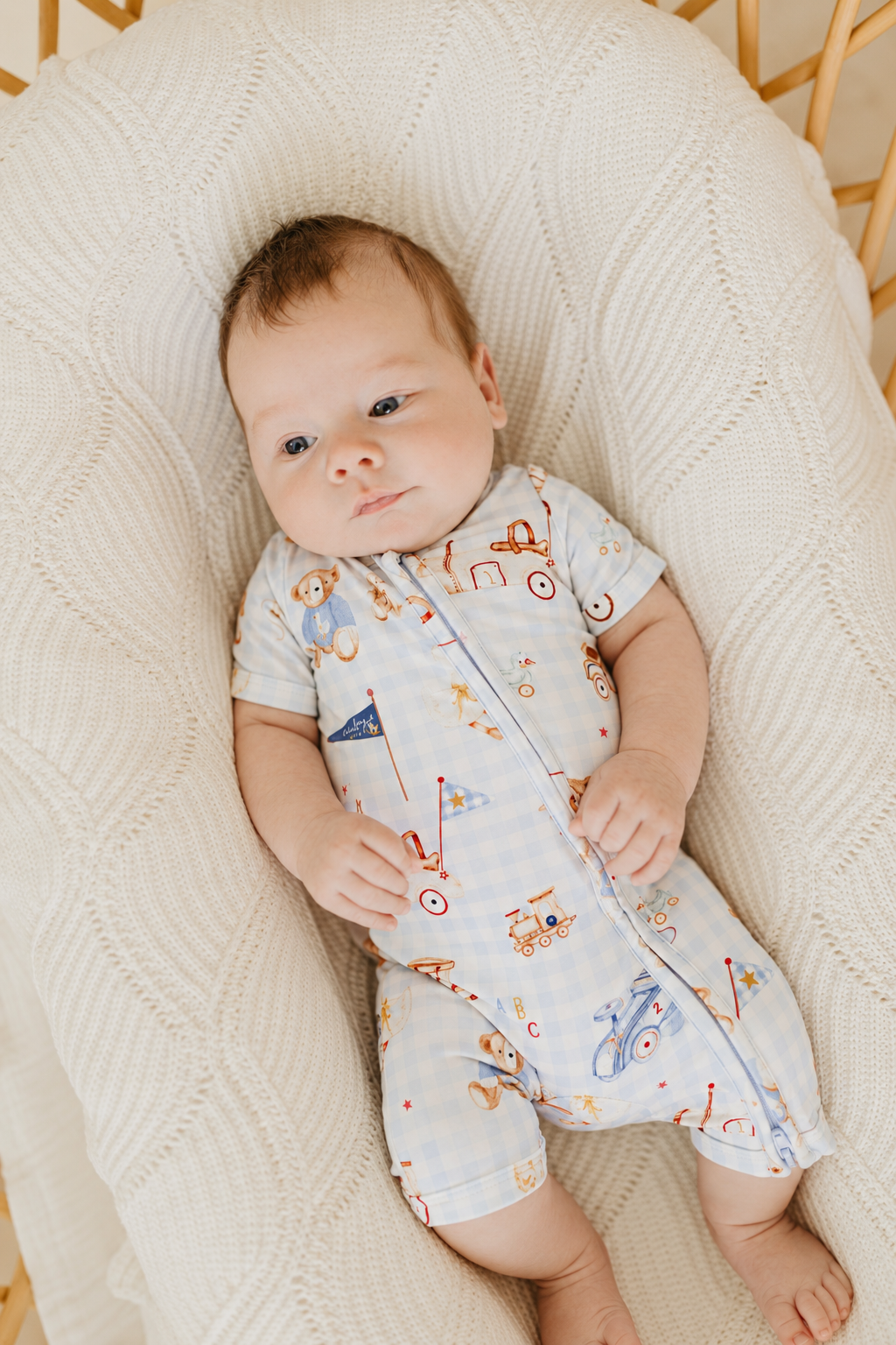 Confetti Kidz Zip Romper in Toy Parade, worn