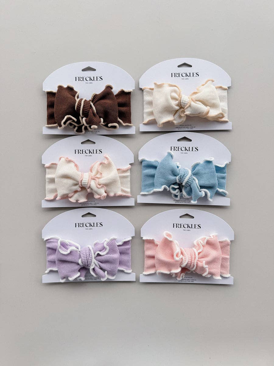 Freckles Knit Frill Baby Headbands in six colourways, including Snow/Butter