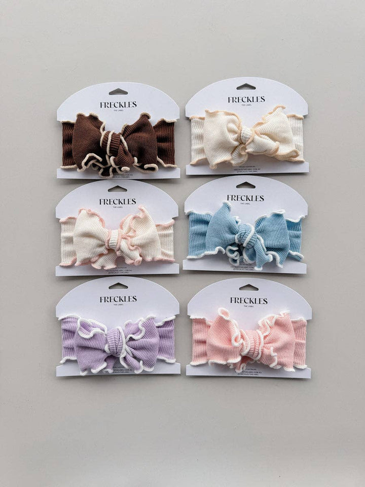 Freckles Knit Frill Baby Headbands in six colourways, including Snow/Butter