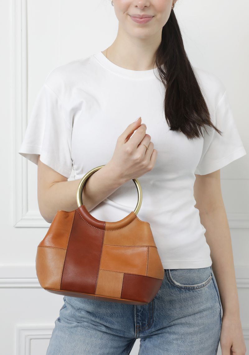 Modapelle Vintage Leather Cross Body Handbag in Tan/Multi, worn by a model