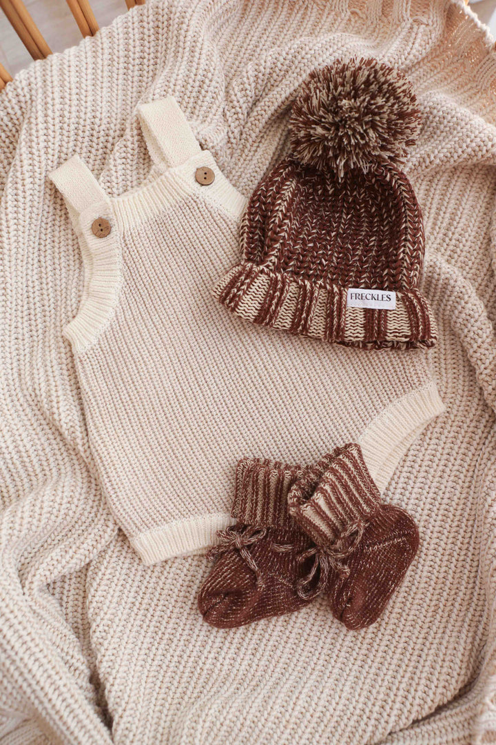 Freckles The Label Chunky Button Romper in Oat styled with a beanie and booties (not included)