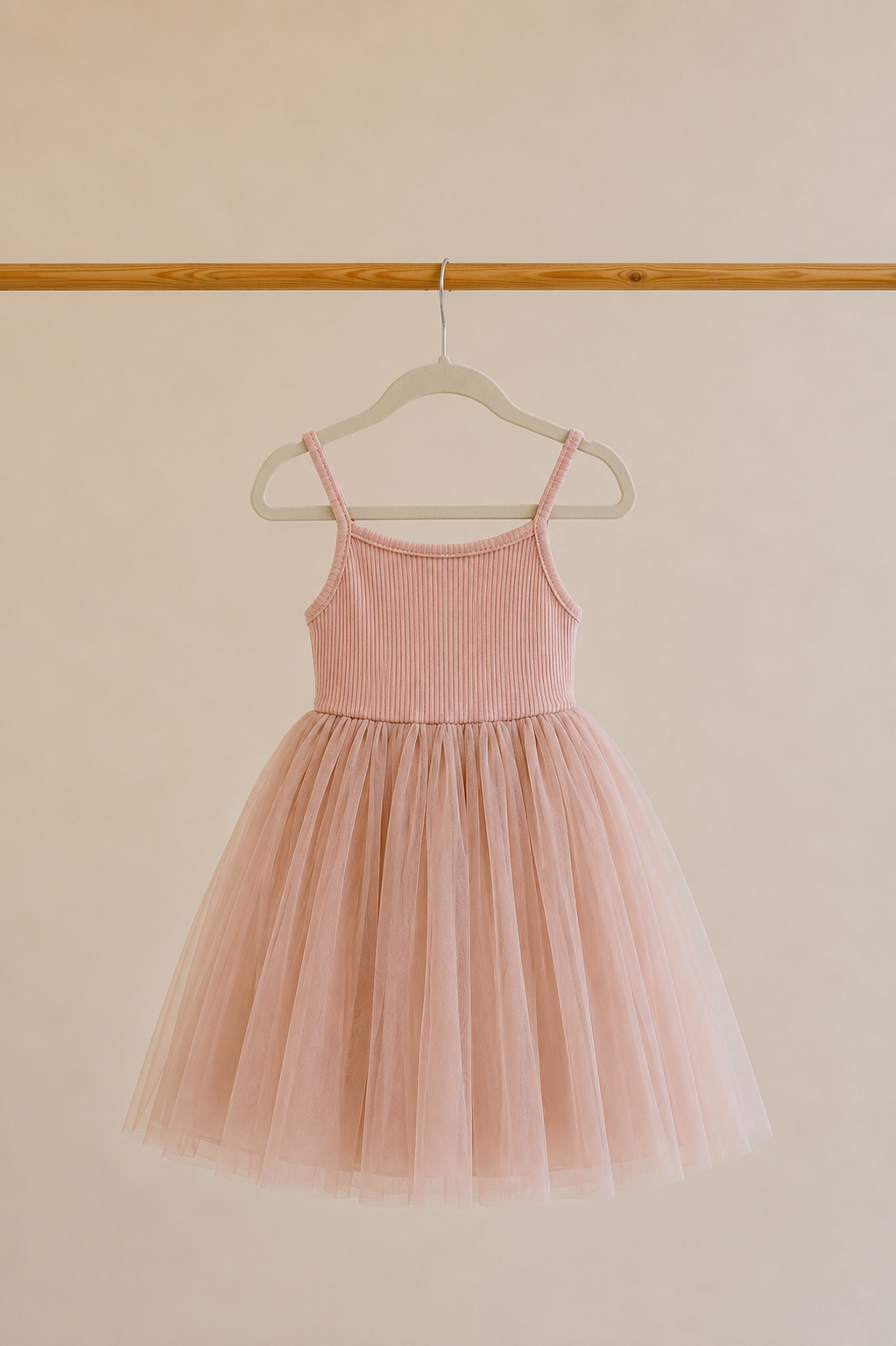 Confetti Kidz Ribbed Tulle Dress in Dusty Pink, shown on its own on a hanger