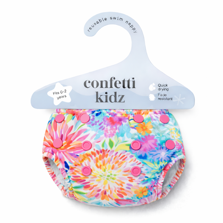 Confetti Kidz Reusable Swim Nappy in Garden Glow, in its packaging