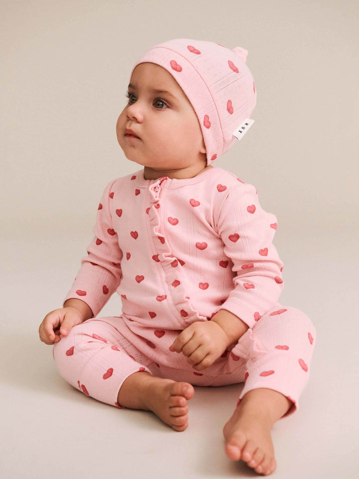 Huxbaby I Heart You Pointelle Frill Zip Romper in Baby Pink - photo 1 of 5