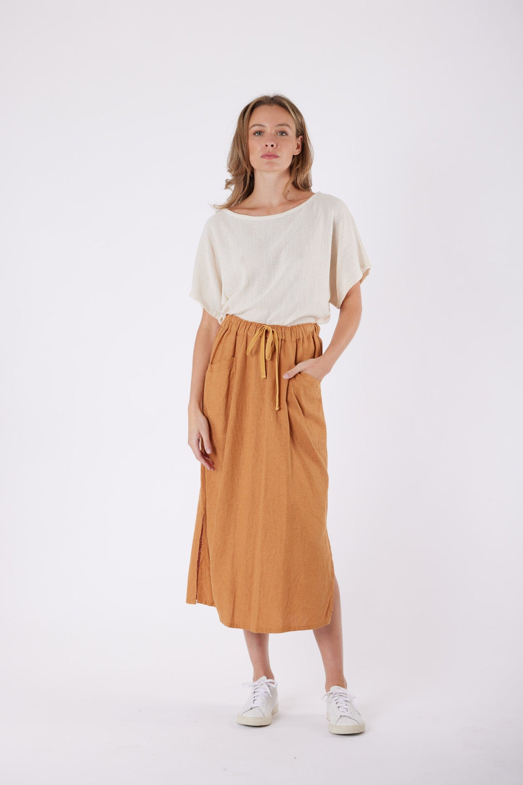 Isla Linen Midi Skirt in Tanzine, worn with a cream top, model shot 8