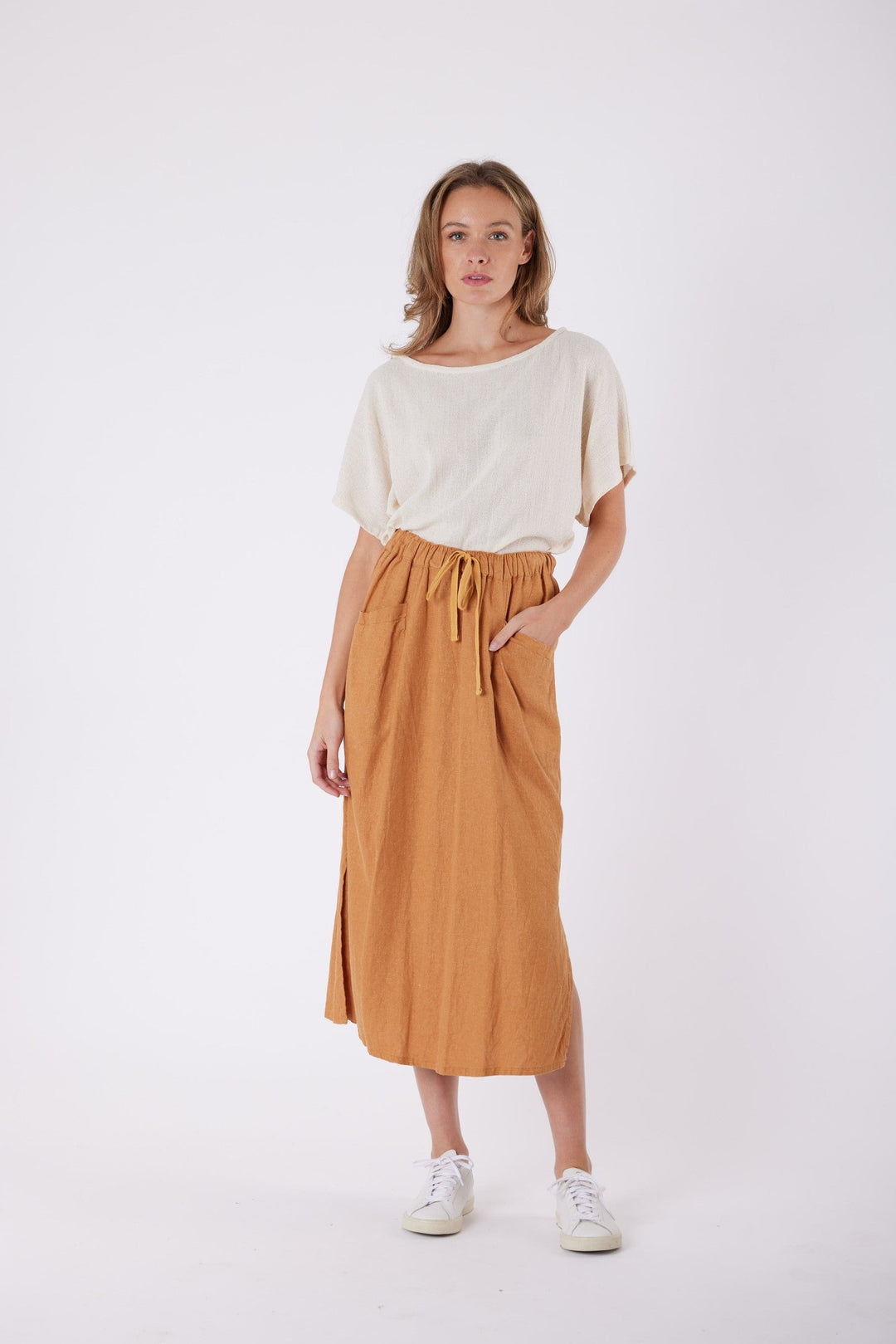 Isla Linen Midi Skirt in Tanzine, worn with a cream top, model shot 9