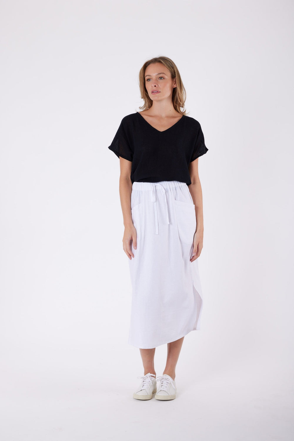Isla Linen Midi Skirt in White, worn with a black tee, model shot 2