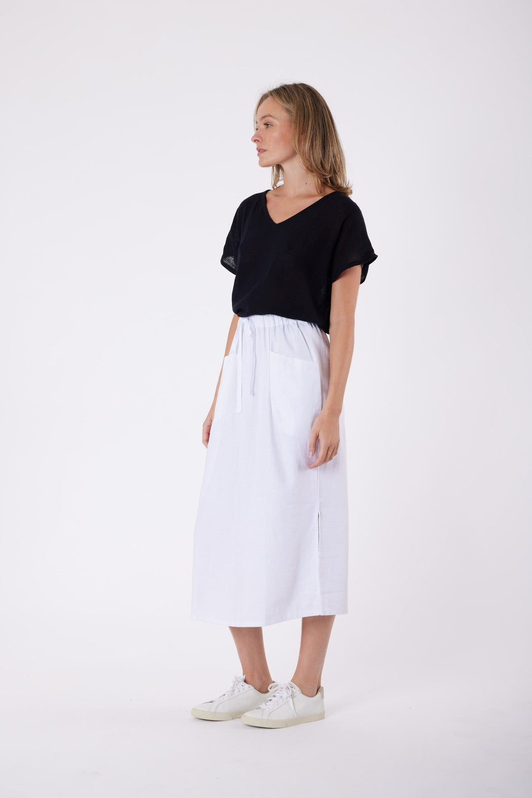 Isla Linen Midi Skirt in White, worn with a black tee, model shot 4