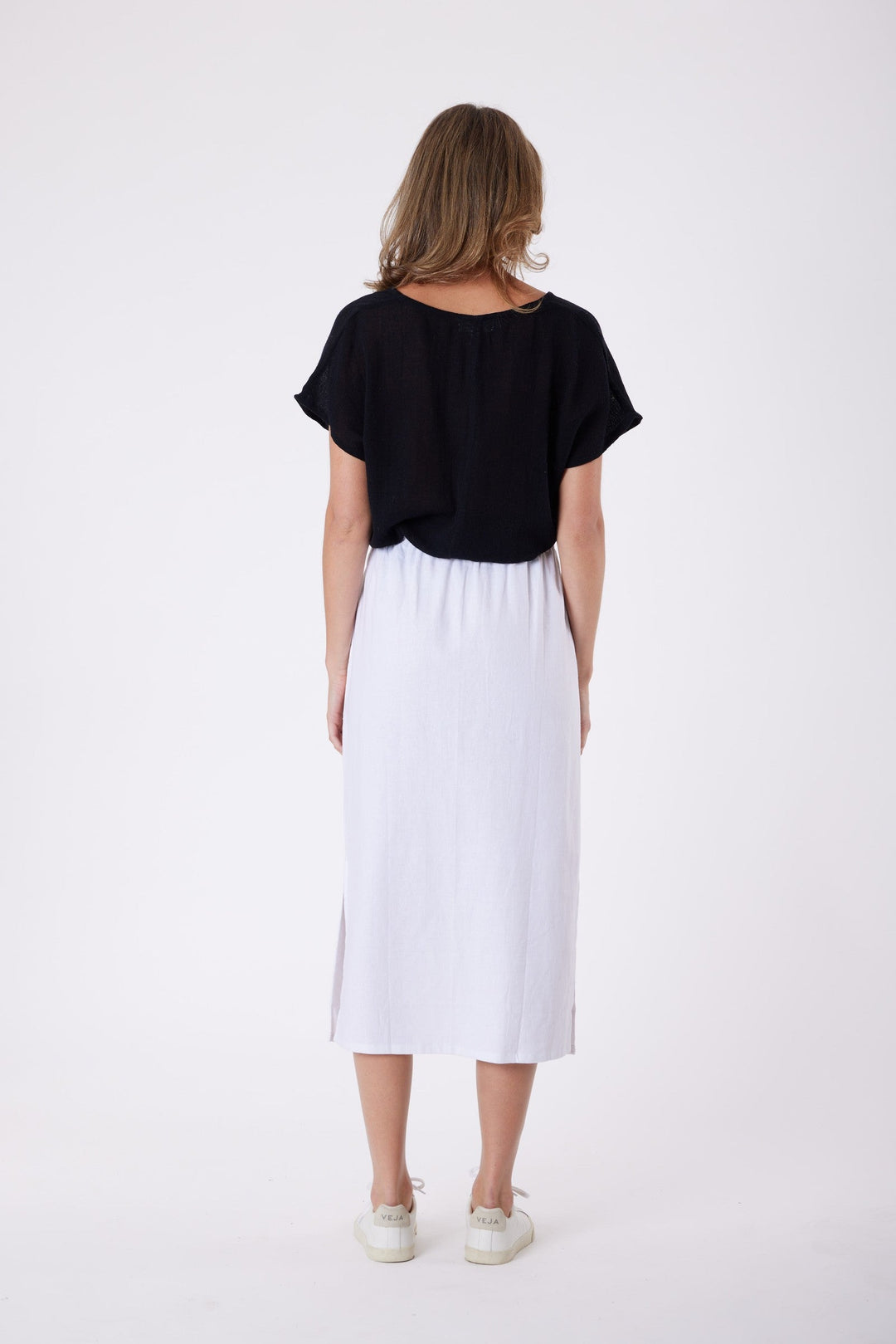 Isla Linen Midi Skirt in White, worn with a black tee, model shot 5