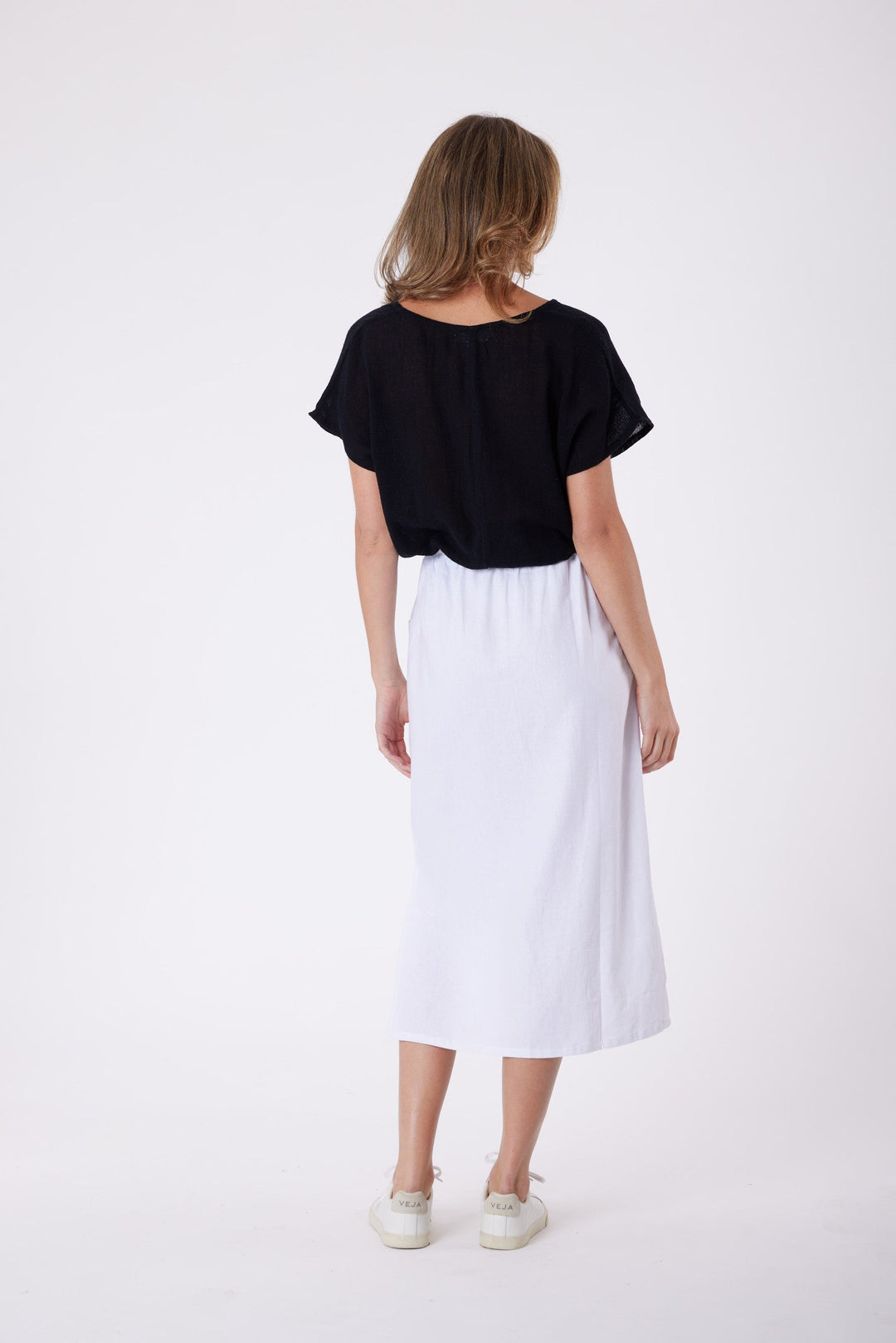 Isla Linen Midi Skirt in White, worn with a black tee, model shot 6