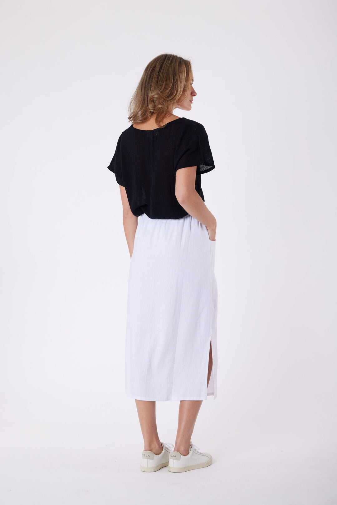 Isla Linen Midi Skirt in White, worn with a black tee, model shot 7