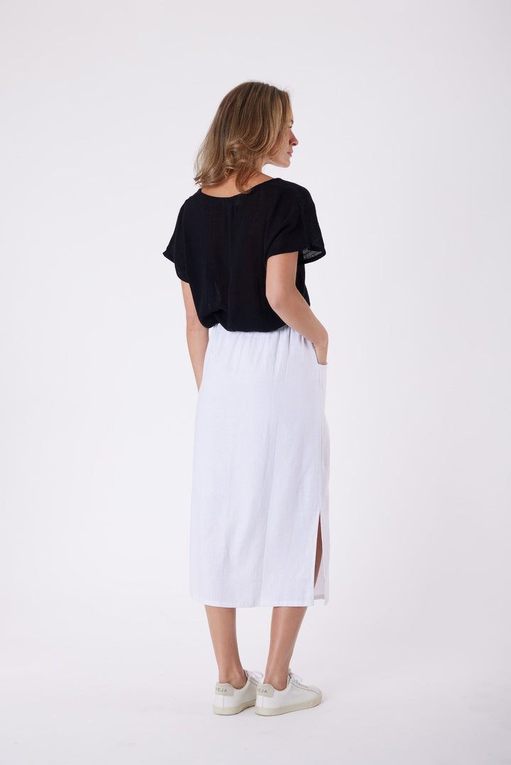 Isla Linen Midi Skirt in White, worn with a black tee, model shot 7