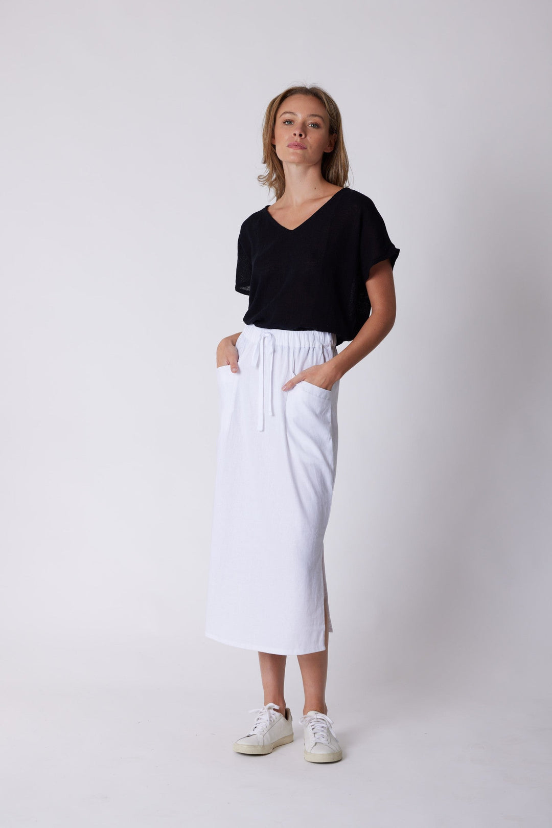 Isla Linen Midi Skirt in White, worn with a black tee, model shot 8
