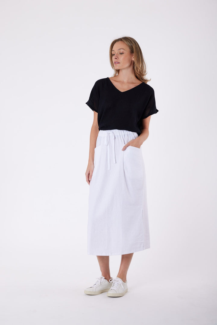 Isla Linen Midi Skirt in White, worn with a black tee, model shot 9