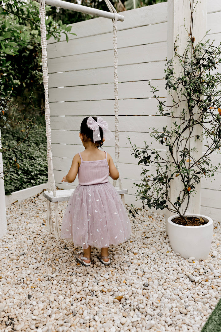 Mauve Butterflies tulle dress worn, showing the layered skirt in movement