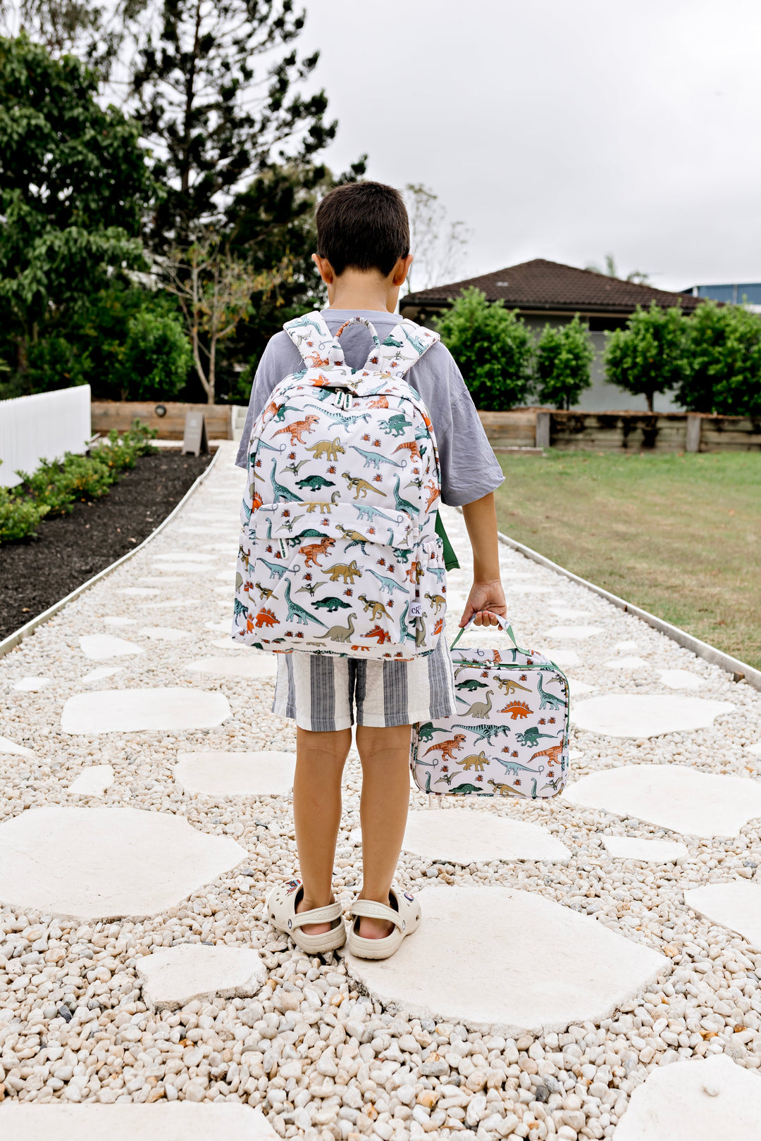Confetti Kidz Early Years Backpack in Dino Land, shown with the matching lunch bag (lunch bag not included)