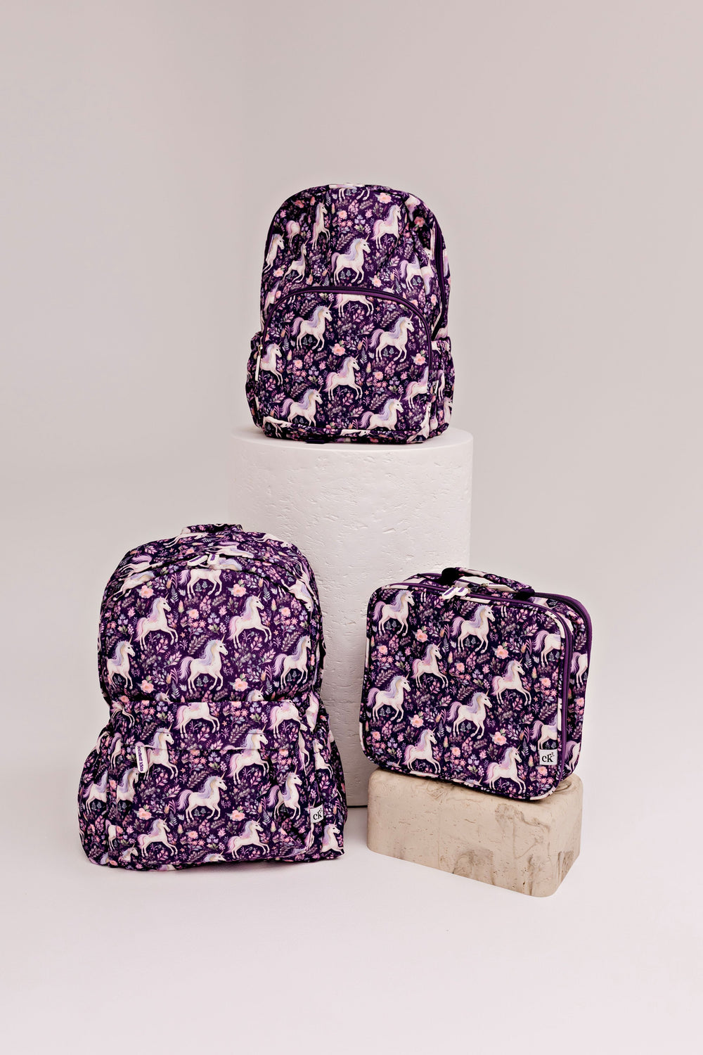 Confetti Kidz Early Years Backpack in Dreamy Unicorn, shown with the larger Junior size and the matching lunch bag (neither included)