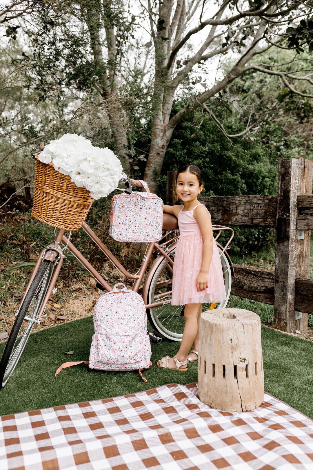 Confetti Kidz Early Years Backpack in Peach Blossom, shown with the matching lunch bag (lunch bag not included)