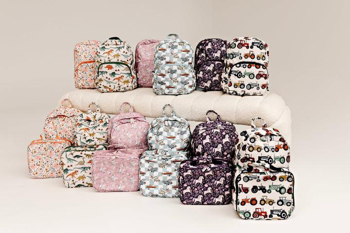 Confetti Kidz Junior Backpack in Swan Dancer, with the rest of the Confetti Kidz range (other prints and lunch bags not included)